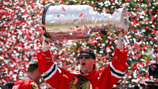 Chicago Blackhawks right wing Patrick Kane celebrates with the Stanley Cup during a rally at Hutchinson Field in Grant Park in Chicago June 28, 2013. The Blackhawks defeated the Boston Bruins to win the 2013 NHL Stanley Cup Championship. REUTERS/Jeff Haynes (UNITED STATES - Tags: SPORT ICE HOCKEY)