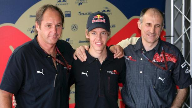 epa01082842 German Formula One driver Sebastian Vettel (C), Co-owner of Scuderia Toro Rosso Gerhard Berger (L) and Teamchief Franz Tost during a press conference in the motorhome at the Hungaroring race track near Budapest, Hungary, 02 August 2007. The Grand Prix of Hungary takes place on Sunday, 05 August. EPA/Jens Buettner