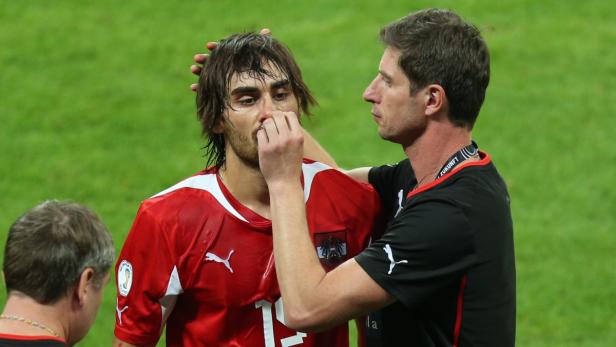 Veli Kavlak (M) of Austria is injured on the nose during the FIFA World Cup 2014 qualification group C soccer match between Germany and Austria at Allianz Arena in Munich, Germany, 06 September 2013. Photo: Daniel Karmann/dpa +++(c) dpa - Bildfunk+++