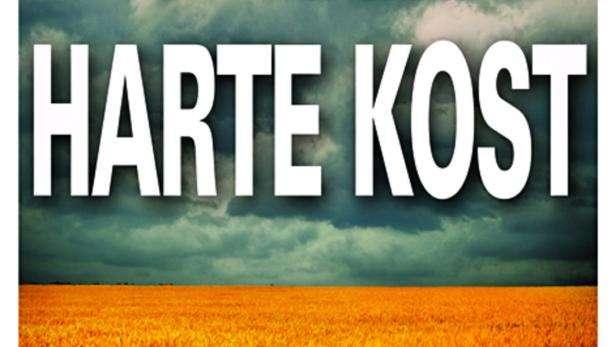 Das Buch „Harte Kost“ von Valentin Thurn und Stefan Kreutzberger vor einem Getreidefeld.