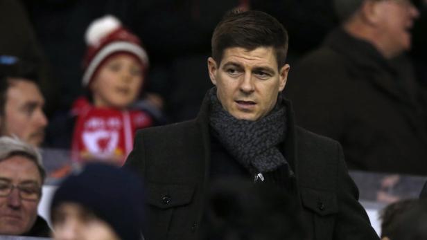 Liverpool's Steven Gerrard takes his seat in the s