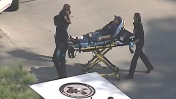 Police and emergency personnel evacuate an injured male on a stretcher outside a building on the Lone Star College Campus near Houston, Texas in this still image taken from video courtesy of KPRC-TV Houston January 22, 2013. Multiple people have been shot according to news reports. REUTERS/KPRC-TV Houston/Handout (UNITED STATES - Tags: CRIME LAW) NO SALES. NO ARCHIVES. FOR EDITORIAL USE ONLY. NOT FOR SALE FOR MARKETING OR ADVERTISING CAMPAIGNS. THIS IMAGE HAS BEEN SUPPLIED BY A THIRD PARTY. IT IS DISTRIBUTED, EXACTLY AS RECEIVED BY REUTERS, AS A SERVICE TO CLIENTS