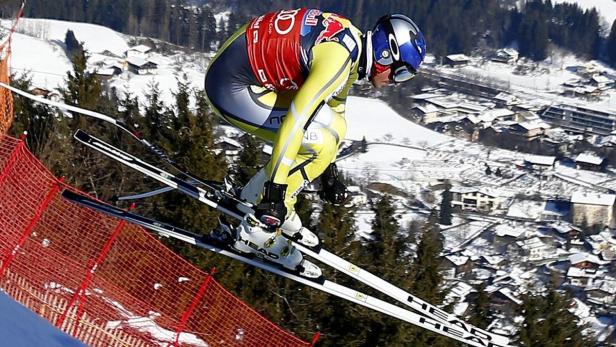 Aksel Lund Svindal of Norway is airborne above the city of Kitzbuehel during the second training for the Alpine Skiing World Cup downhill ski race in Kitzbuehel January 23, 2013. REUTERS/ Dominic Ebenbichler (AUSTRIA - Tags: SPORT SKIING)