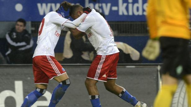 Hamburger SV&#039;s scorers Heung-min Son (L) and Dennis Aogo celebrate after scoring during their German Bundesliga first division soccer match against Werder Bremen in Hamburg January 27, 2013. REUTERS/Fabian Bimmer (GERMANY - Tags: SPORT SOCCER) DFL RULES TO LIMIT THE ONLINE USAGE DURING MATCH TIME TO 15 PICTURES PER GAME. IMAGE SEQUENCES TO SIMULATE VIDEO IS NOT ALLOWED AT ANY TIME. FOR FURTHER QUERIES PLEASE CONTACT DFL DIRECTLY AT + 49 69 650050