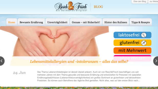 Hände formen ein Herz vor dem Bauch einer Frau, thematisch passend zu Lebensmittelallergien und -intoleranzen.