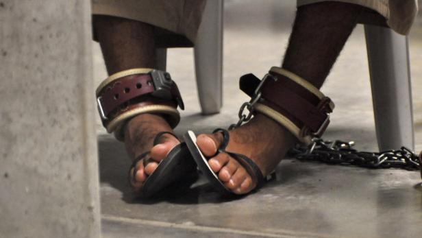 In this April 27, 2010 file photo, reviewed by a U.S. Department of Defense official, a Guantanamo detainee&#039;s feet are shackled to the floor as he attends a &quot;Life Skills&quot; class inside the Camp 6 high-security detention facility at Guantanamo Bay U.S. Naval Base. January 11, 2012 marks the 10th anniversary of the opening of the U.S. military detention camp at the Guantanamo Bay U.S. naval base in eastern Cuba. REUTERS/Michelle Shephard/Pool/Files (MILITARY POLITICS CRIME LAW) FOR EDITORIAL USE ONLY. NOT FOR SALE FOR MARKETING OR ADVERTISING CAMPAIGNS