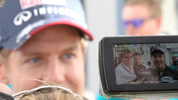 Der Mann im Fokus: Vierfach-Weltmeister Vettel kam vom Rasenmähen nach Abu Dhabi.