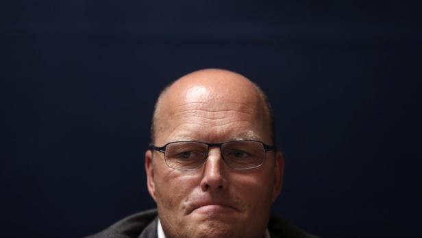 Saxo Bank cycling team director Riis looks on duri