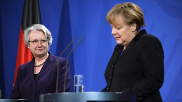 epa03575012 German Chancellor Angela Merkel (R) and German Education and Research Minister Annette Schavan give a statement to the media to announce Schavan&#039;s resignation, at the chancellery in Berlin, Germany, 09 February 2013. Germany&#039;s embattled Education and Science Minister Annette Schavan resigned 09 February over a plagiarism scandal, dealing an election-year blow to Angela Merkel&#039;s government. A university panel 07 February found the Christian Democratic Union (CDU) minister guilty of &#039;deliberate deception&#039; for using foreign text passages without proper citation in her 33-year-old thesis. Chancellor Merkel in the joint news conference with Schavan said she had accepted her resignation &#039;with a heavy heart&#039; and praised the minister&#039;s achievements in her 17-year political career. EPA/MICHAEL KAPPELER