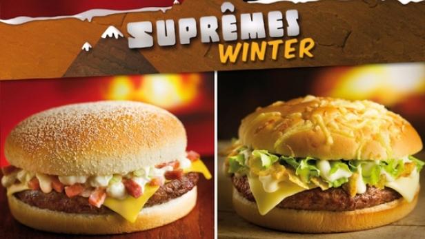 Zwei „Suprêmes Winter“-Burger von Quick, einer mit Speck, der andere mit Käsefondue.