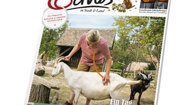 Das Cover des „Servus Kinder“-Magazins zeigt eine Tierärztin, die eine Ziege untersucht.