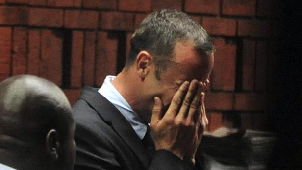South African &#039;Blade Runner&#039; Oscar Pistorius breaks down during his court appearance in Pretoria February 15, 2013. Pistorius, a double amputee who became one of the biggest names in world athletics, broke down in tears on Friday after he was charged in court with shooting dead his girlfriend, 30-year-old model Reeva Steenkamp, in his Pretoria house. REUTERS/Antonie de Ras (SOUTH AFRICA - Tags: SPORT CRIME LAW ATHLETICS TPX IMAGES OF THE DAY OLYMPICS) NO SALES. NO ARCHIVES. FOR EDITORIAL USE ONLY. NOT FOR SALE FOR MARKETING OR ADVERTISING CAMPAIGNS. SOUTH AFRICA OUT. NO COMMERCIAL OR EDITORIAL SALES IN SOUTH AFRICA