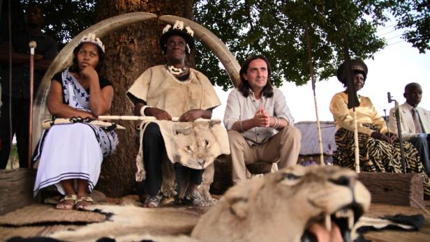 Mukuni Village in Southern Zambia. Neil Oliver talks to Chief Mukuni about Livingstone?s legacy. They are sitting under the same tree as Livingstone sat in 1855.