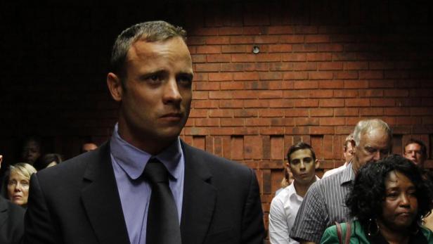&quot;Blade Runner&quot; Oscar Pistorius awaits the start of court proceedings in the Pretoria Magistrates court February 19, 2013. Pistorius, a double amputee who became one of the biggest names in world athletics, was applying for bail after being charged in court with shooting dead his girlfriend, 30-year-old model Reeva Steenkamp, in his Pretoria house. REUTERS/Siphiwe Sibeko (SOUTH AFRICA - Tags: CRIME LAW SPORT ATHLETICS)