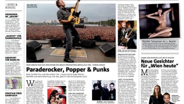 Bruce Springsteen spielt Gitarre vor einer großen Menschenmenge.