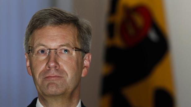 File picture shows German President Christian Wulff at a ceremony to present the Charity Stamp 2012 at Bellevue Castle in Berlin January 11, 2012. German state prosecutors accused former President Christian Wulff on April 12, 2013 of accepting a bribe in exchange for a political favour, a year after scandal forced him to resign from the largely ceremonial post. Picture taken January 11, 2012. REUTERS/Fabrizio Bensch/File (GERMANY - Tags: POLITICS HEADSHOT)