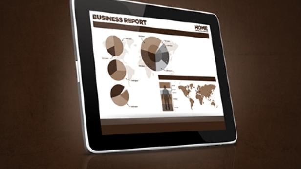 Ein Tablet zeigt einen Business Report mit Diagrammen und einer Weltkarte.