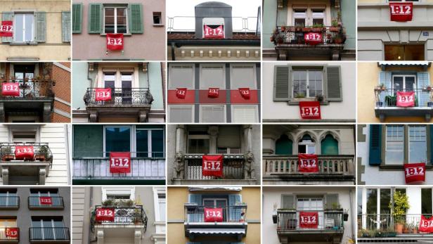 Eidgenossen in Zürich und Bern zeigen Flagge: Die Bewohner werben für ein Ja zum Referendum über die Beschränkung der Chefgehälter auf das Zwölffache des niedrigsten Gehalts im Unternehmen .