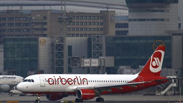 Airberlin plane taxis towards runway in front of p