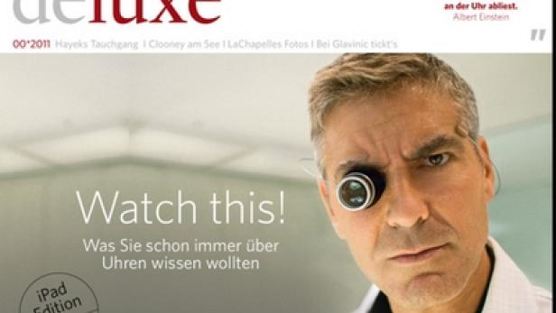 Titelseite des „Wirtschaftsblatt Deluxe“ mit George Clooney, der eine Uhrmacherlupe trägt.