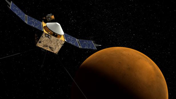 Eine Raumsonde nähert sich dem Mars vor einem Sternenhintergrund.