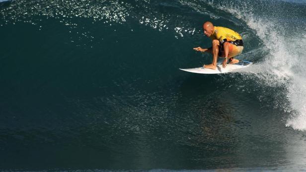 Ten-time world champion Slater surfs during the th