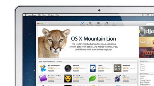Ein MacBook-Bildschirm zeigt die Benutzeroberfläche von OS X Mountain Lion mit einem Berglöwen-Hintergrund.