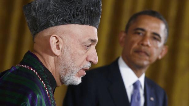 Afghan President Karzai addresses a joint news con