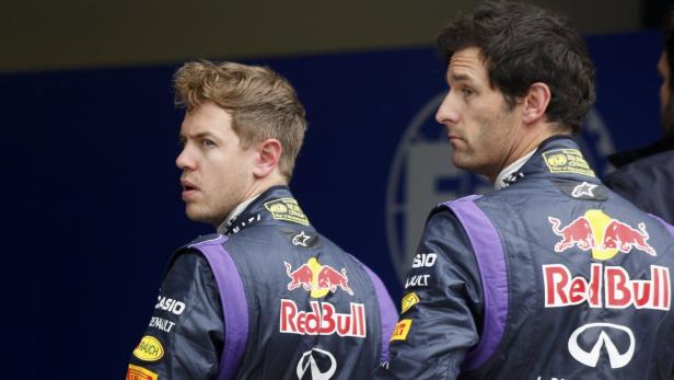 Red Bull Formula One drivers Sebastian Vettel of Germany and Mark Webber of Australia (R) look on after the qualifying session of the Australian F1 Grand Prix at the Albert Park circuit in Melbourne March 17, 2013. REUTERS/Daniel Munoz (AUSTRALIA - Tags: SPORT MOTORSPORT F1)