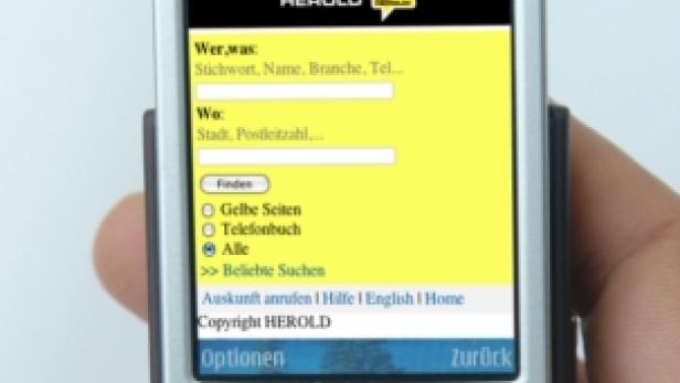 Ein Nokia N95 Handy zeigt die mobile Version der „Gelbe Seiten“-App von Herold.