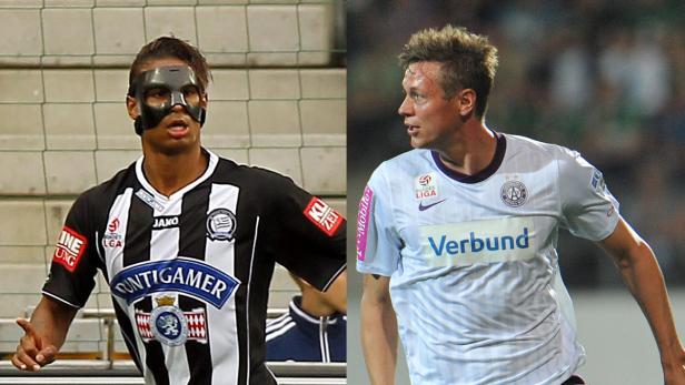 Zwei Fußballspieler während eines Spiels, einer mit einer Gesichtsmaske.