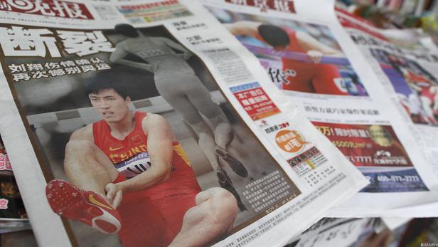 Eine chinesische Zeitung mit einem Artikel über den Sportler Liu Xiang bei den Olympischen Spielen 2012.