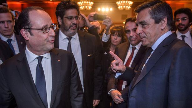 Francois Hollande (li.) mit Francois Fillon