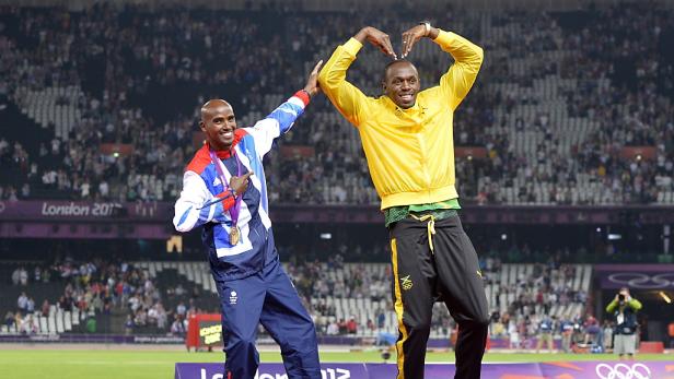 Usain Bolt und Mo Farah posieren bei den Olympischen Spielen 2012 in London.