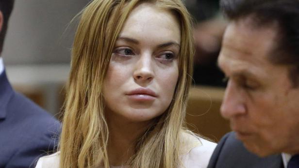 51040922 Actress Lindsay Lohan appear at a hearing in Los Angeles Superior Court on March 18, 2013 in Los Angeles, California. The hearing is to determine whether Lohan returns to jail or averts a trial on charges that she lied to police over a June, 2012 car crash that briefly sent her to the hospital. Lohan has pleaded not guilty to three misdemeanor charges filed after the accident - reckless driving, lying to police and obstructing officers from performing their duties.