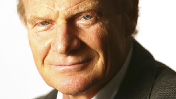 Porträt eines Mannes mit hellen Haaren und freundlichem Blick.