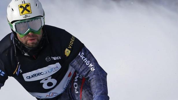 Austria&#039;s Andreas Prommegger competes during the men&#039;s parallel slalom qualifications at the FIS Snowboard World Championships in Stoneham, Quebec, January 27, 2013. REUTERS/Mathieu Belanger (CANADA - Tags: SPORT SNOWBOARDING)