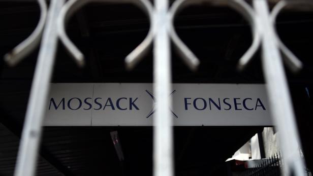 (FILES) This file photo taken on April 4, 2016 shows a sign outside the building where Panama-based Mossack Fonseca law firm offices are in Panama City. The growing global scrutiny and cascade of falling heads kicked off in April with the Panama Papers: a massive leak from a small Panamanian law firm, Mossack Fonseca, that showed how the world&#039;s wealthy stashed their riches in offshore tax havens. / AFP PHOTO / RODRIGO ARANGUA