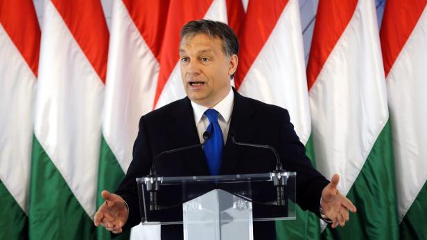 epa03188378 Hungarian Prime Minister Viktor Orban speaks during the ceremonial inauguration of the new Richter Gedeon biotechnology plant in, Debrecen, 226 kms east of Budapest, Hungary, 19 April 2012. The new biotechnology plant was built with an investment of 84 million euros, and creates 120 new jobs. EPA/ZSOLT CZEGLEDI HUNGARY OUT