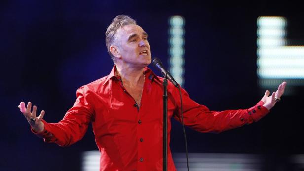 RE-FILE -- CHANGING SLUG British singer-songwriter Morrissey performs during the International Song Festival in Vina del Mar city, about 121 km (75 miles) northwest of Santiago, in this February 24, 2012 file photo. Morrissey is cancelling the remaining shows on his U.S. tour for medical reasons, after suffering a number of health mishaps in recent months including a bleeding ulcer and double pneumonia, his spokeswoman said March 15, 2013. REUTERS/Eliseo Fernandez/Files (CHILE - Tags: ENTERTAINMENT SOCIETY)