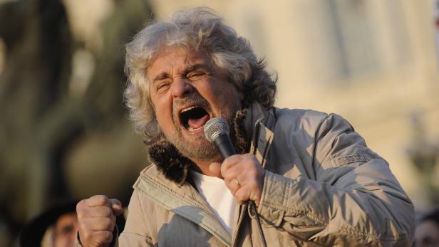 Five-Star Movement leader and comedian Beppe Grillo gestures during a rally in Turin in this February 16, 2013 file photo. Regardless of who wins next weekend&#039;s parliamentary election, Italy&#039;s long economic decline is likely to continue because the next government won&#039;t be strong enough to pursue the tough reforms needed to make its economy competitive again. To match Insight ITALY-ELECTION/ REUTERS/Giorgio Perottino/Files (ITALY - Tags: POLITICS ELECTIONS)