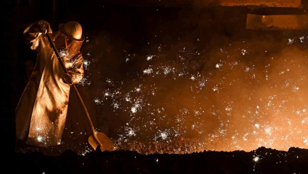 FILE PHOTO: A steel worker stands at a furnace at the plant of German steel company Salzgitter AG in Salzgitter, Lower Saxony on March 17, 2015. REUTERS/Fabian Bimmer/File Photo GLOBAL BUSINESS WEEK AHEAD - SEARCH GLOBAL BUSINESS 22 MAY FOR ALL IMAGES
