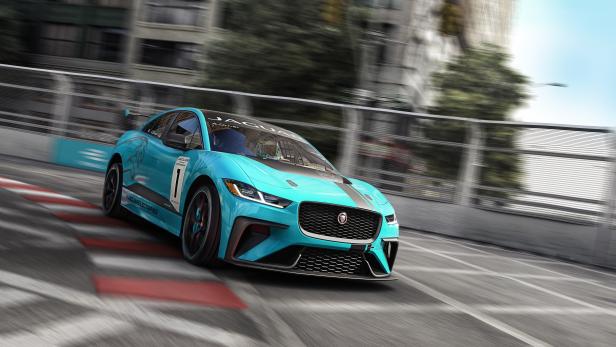Ein türkisfarbener Jaguar I-Pace eTrophy-Rennwagen auf einer Rennstrecke.