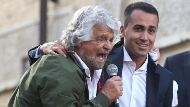 5-Star movement members Beppe Grillo (L) and Luigi Di Maio attend a demonstration against the new electoral law in downtown Rome, Italy October 25, 2017. REUTERS/Tony Gentile