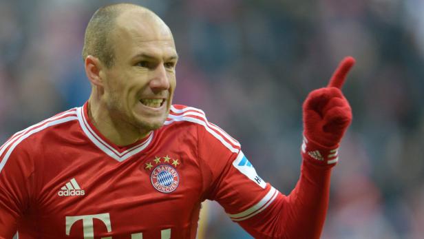 Arjen Robben im Trikot des FC Bayern München jubelt mit erhobenem Zeigefinger.