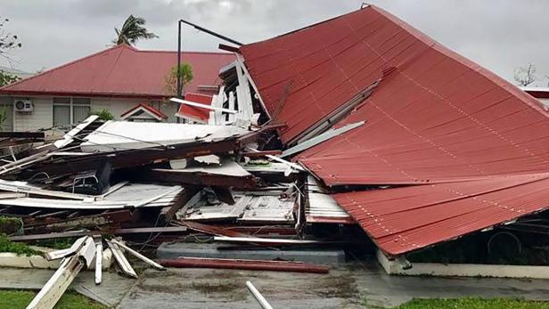 This handout photo taken and received from Jamie Motu&#039;apuaka on Facebook on February 13, 2018 shows a damaged building at the Parliament House in Tonga&#039;s capital of Nuku&#039;alofa after Cyclone Gita hit the country. Nuku&#039;alofa awoke to scenes of devastation on February 13 after the most powerful cyclone ever recorded in the Tongan capital tore roofs off buildings, downed powerlines and caused extensive flooding, prompting a state of emergency in the tiny Pacific nation. / AFP PHOTO / JAMIE MOTU&#039;APUAKA / Jamie MOTU&#039;APUAKA / -----EDITORS NOTE --- RESTRICTED TO EDITORIAL USE - MANDATORY CREDIT &quot;AFP PHOTO / JAMIE MOTU&#039;APUAKA&quot; - NO MARKETING - NO ADVERTISING CAMPAIGNS - DISTRIBUTED AS A SERVICE TO CLIENTS - NO ARCHIVES