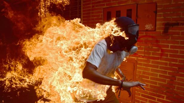 Catching fire: Demonstrant in Venezuela.