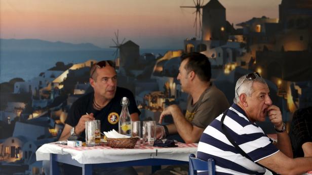 People eat their lunch at a restaurant in central