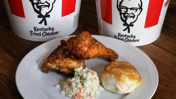 A Kentucky Fried Chicken (KFC) plate of mixed fried and grilled chicken with a biscuit and coleslaw is seen in this picture illustration taken April 6, 2017. REUTERS/Carlo Allegri