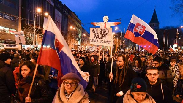 Protesters wave national flags during a rally under the slogan &quot;For a Decent Slovakia&quot;, against corruption and to pay tribute to murdered Slovak journalist Jan Kuciak and his fiancee Martina Kusnirova on March 9, 2018 at the Slovak National Uprising (SNP) square in Bratislava, Slovakia. Demonstrations were expected to be held in dozens of Slovak cities and also abroad after the murder of investigative journalist Jan Kuciak, who was probing alleged high-level political corruption / AFP PHOTO / JOE KLAMAR